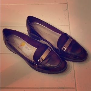 Brown and black loafers